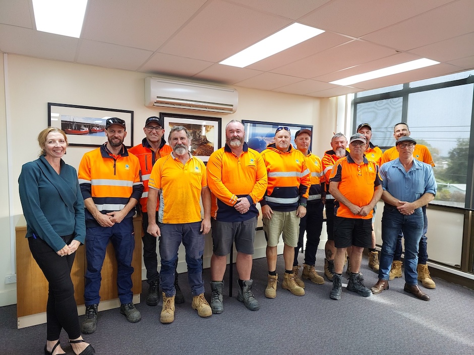 Community members engaged in conversation at a local gathering